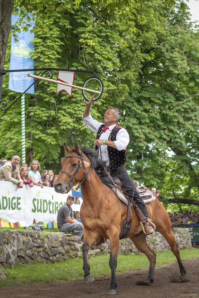 Castelrotto / Kastelruth, South Tyrol, Italy. The traditional ring jousting at the Mount Calvario in Castelrotto 