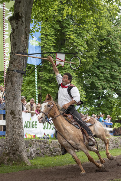 Castelrotto / Kastelruth, South Tyrol, Italy. The traditional ring jousting at the Mount Calvario in Castelrotto 