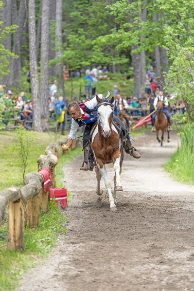 Fie, South Tyrol, Italy. The third tournament at Lake Fiè is the gallop. The wooden ball must be put into the basket