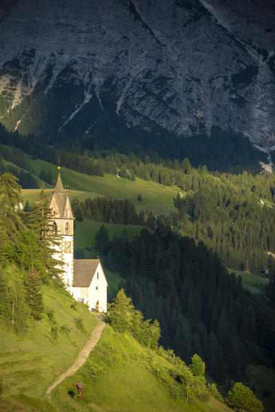 La Valle / Wengen, Alta Badia, Bolzano province, South Tyrol, Italy. The St. Barbara chapel at sunset