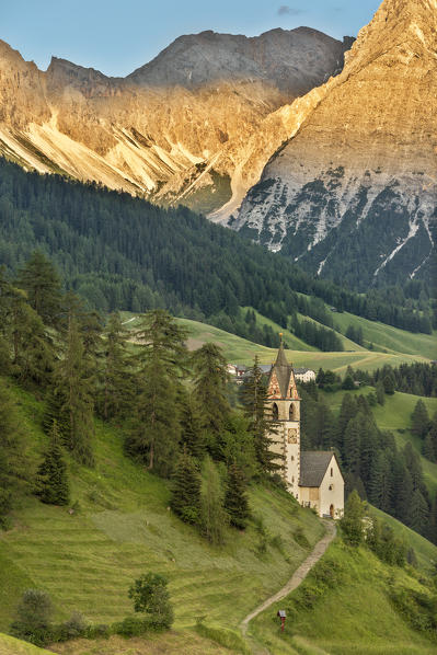 La Valle / Wengen, Alta Badia, Bolzano province, South Tyrol, Italy. The St. Barbara chapel at sunset