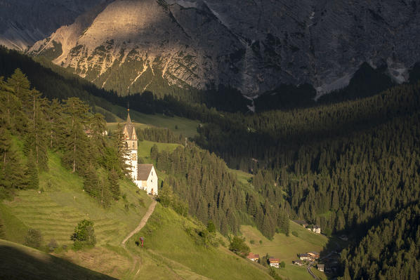 La Valle / Wengen, Alta Badia, Bolzano province, South Tyrol, Italy. The St. Barbara chapel at sunset