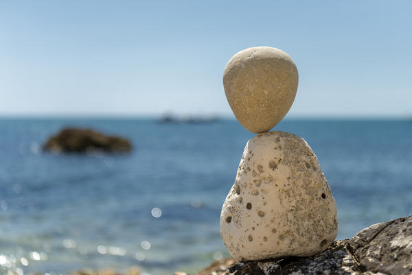 Sirolo, province of Ancona, Marche, Italy, Europe. On the beach of Sassi Neri (black stones)