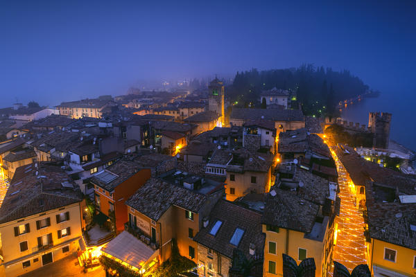 Sirmione seen from the Scaligero castle at the blue hour, Brescia province, Lombardy district, Italy.