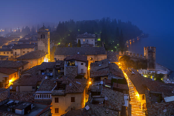 Sirmione seen from the Scaligero castle at the blue hour, Brescia province, Lombardy district, Italy.