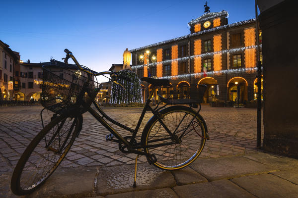 The blue hour in the central square of Iseo, Brescia province, Lombardy district, Italy.