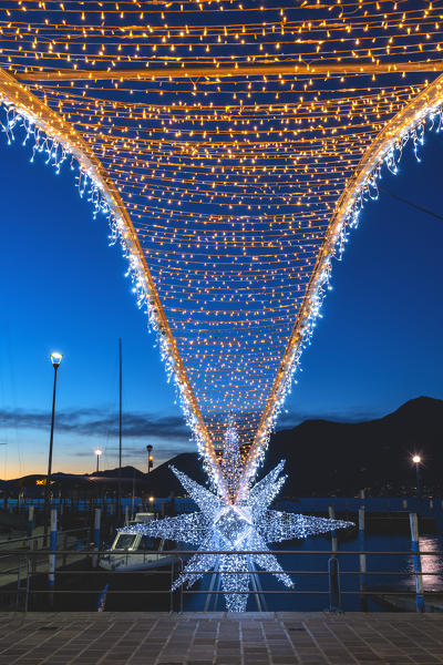 The blue hour in the Christmas village of Iseo, Brescia province, Lombardy district, Italy.