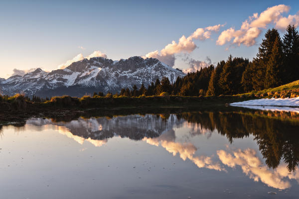 The Presolana is reflected at sunset, Seriana valley in Bergamo province, Lombardy, Europe, Italy