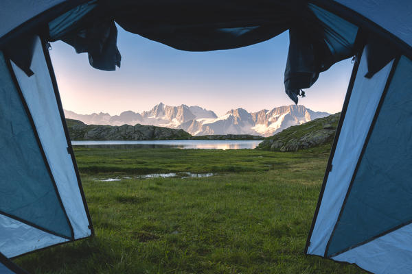 The view from the tent in the morning of the Presanella, Laghetti di Strino, Trentino Alto Adige, Italy