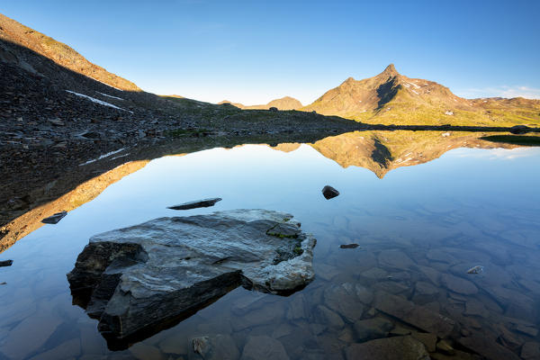 Monte Gavia in the mirror at dawn in Lombardy, Brescia province, Italy