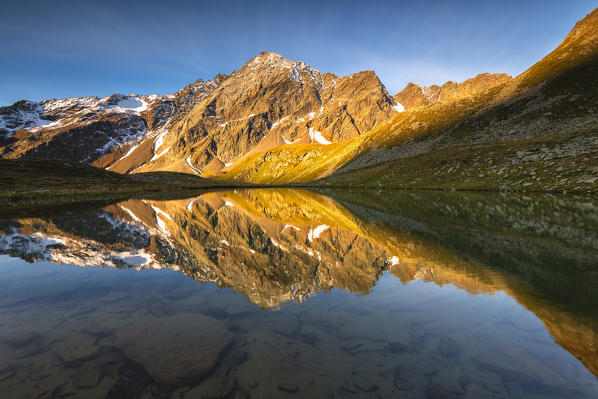 Valmalza lake during a sunrise in Camonica valley, Ponte di Legno, Brescia province, Lombardy, Italy, Europe.