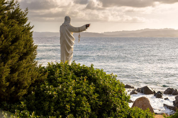 Statue of Christ on the beach, Sardinia, Sassari province, Italy, Europe.