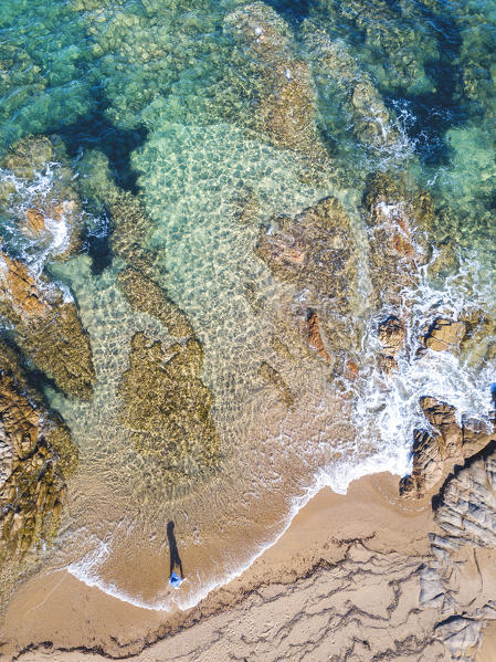 Aerial view of the beach with woman, Vignola mare, Sassari province, Gallura, Italy, Europe, Sardinia.