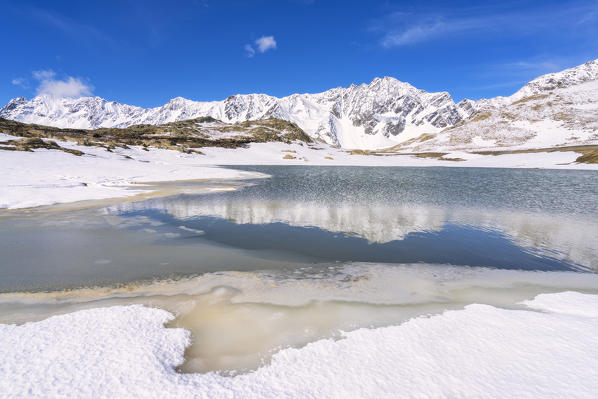 Lago Nero at thaw in Gavia pass, Brescia province, Lombardy district, Italy, Europe