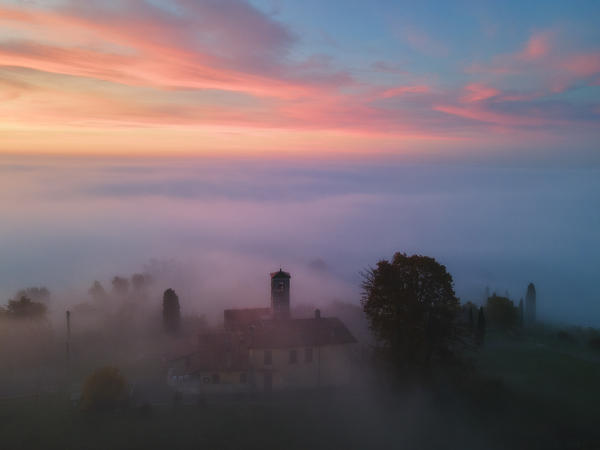 Church of Madonna di Santo Stefano over the fog at dawn, Brescia province, Lombardy district, Italy, Europe.