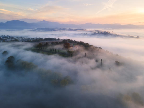 Franciacorta Hills at dawn over the fog, Brescia province, Lombardy district, Italy, Europe.