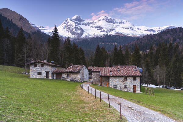 Baite del Moschel at sunset in Valzurio, Orobie alps in Bergamo province, Lombardy, Italy.