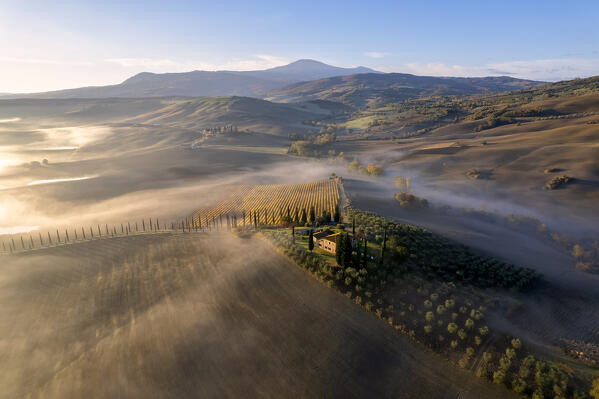 Farmhouse in Orcia valley aerial view in the morning, Siena province in Tuscany, Italy.