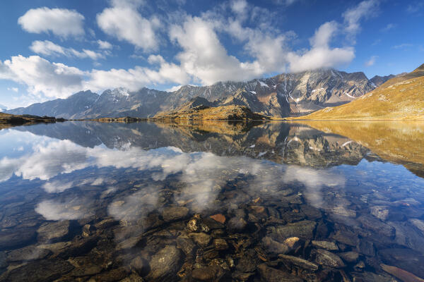 Black lake at Gaviapass in the morning, Brescia province in Lombardy district, Italy.