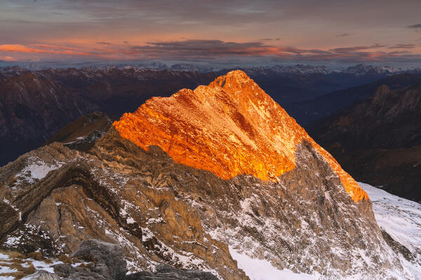 Landscape from italian alps during a winter sunrise in Adamello park, Brescia province in Lombardy district, Italy.