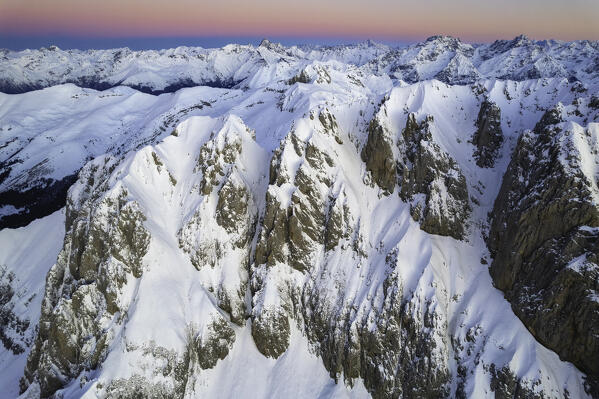 Landscape of Italian Alps in Winter season, Aerial view from Presolana group during a sunrise, Orobie alps in Bergamo province, Seriana valley in Italy, Europe.