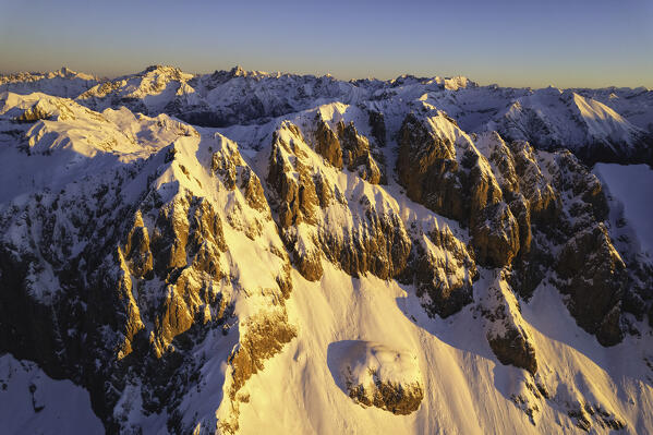 Landscape of Italian Alps in Winter season, Aerial view from Presolana group during a sunrise, Orobie alps in Bergamo province, Seriana valley in Italy, Europe.