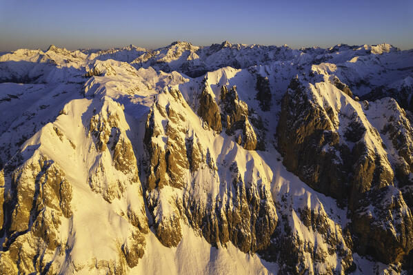 Landscape of Italian Alps in Winter season, Aerial view from Presolana group during a sunrise, Orobie alps in Bergamo province, Seriana valley in Italy, Europe.