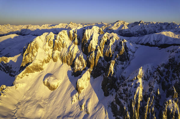 Landscape of Italian Alps in Winter season, Aerial view from Presolana group during a sunrise, Orobie alps in Bergamo province, Seriana valley in Italy, Europe.