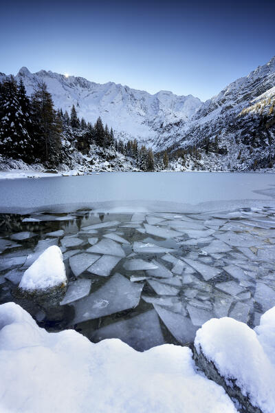 Winter sunrise over Aviolo lake in Vezza d'Oglio, Brescia province in Lombardy district, Italy, Europe.