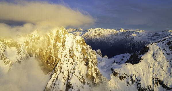 Landscape of Italian Alps in Winter season, Aerial view from Pizzo Camino group during a sunrise, Brescia province, Vallecamonica in Italy, Europe.