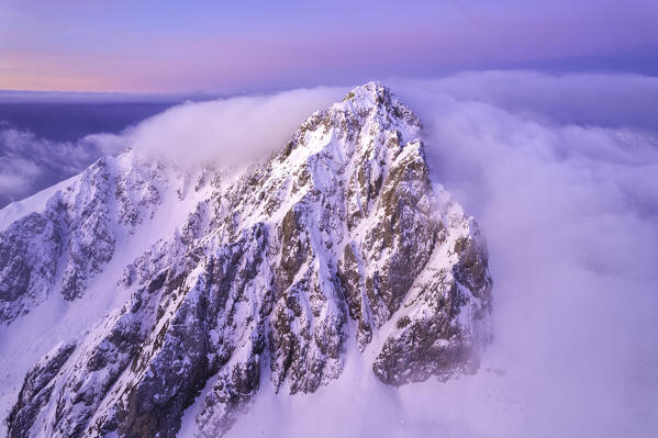 Landscape of Italian Alps in Winter season, Aerial view from Pizzo Camino group during a sunrise, Brescia province, Vallecamonica in Italy, Europe.