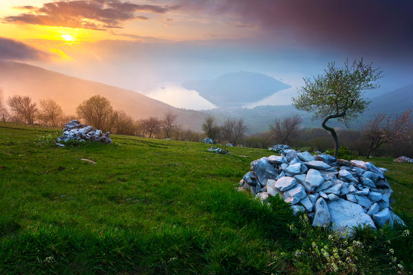 Lake Iseo, at sunset. The island of Monte Isola, in the middle of the lake, closed in the mountains that divide the two provinces, Bergamo and Brescia