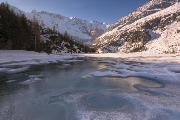 Thaw in Aviolo lake, Adamello park, province of Brescia, Italy.