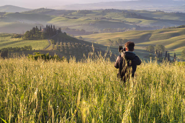 Europe, Italy, Photographing in Orcia Valley, Tuscany, province of Siena.