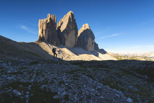 Hiker and the three peaks of Lavaredo, Bolzano province, Trentino Alto Adige, Italy.