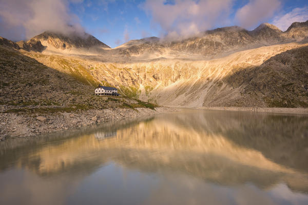 Garibaldi refuge at sunset in Adamello park, Brescia province, Lombardy district, Europe, Italy.