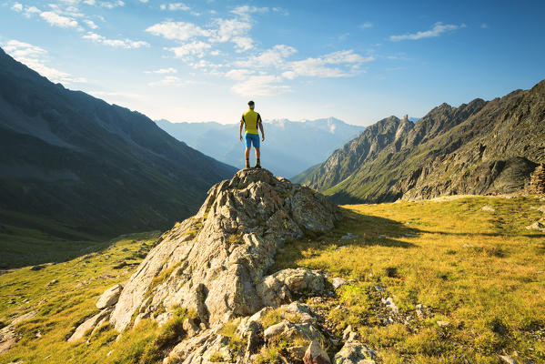 Hiker in Canè Valley, Brescia province, Lombardy district, Italy, Europe.