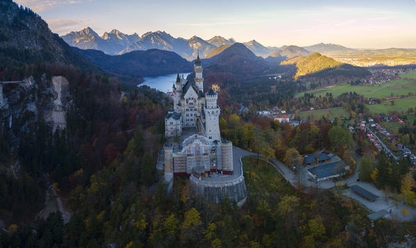 Aerial view of Neuschwanstein Castle in Autumn at sunrise Europe, Germany, Bavaria, southwest Bavaria, Fussen, Schwangau