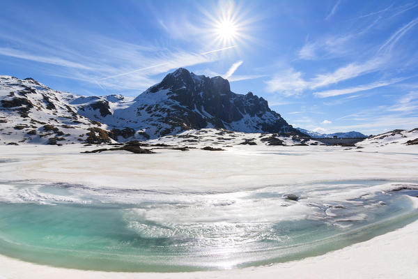 Thaw in Adamello Park, Vacca lake in Lombardy, Italy, Brescia province.