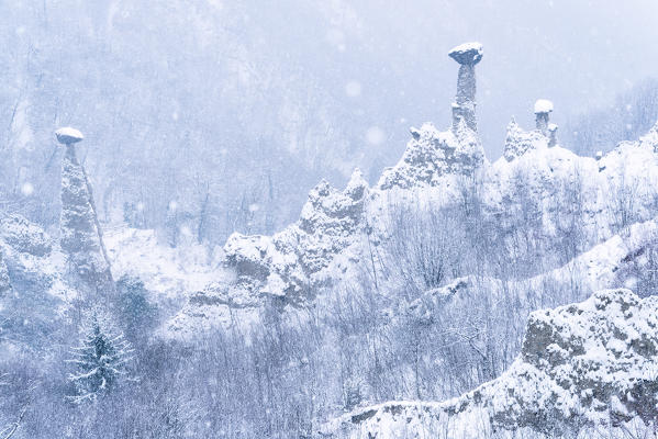 Zone Pyramids under the snow, Lombardy district, Brescia province, Italy.