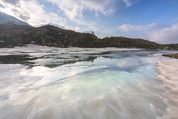 Seroti lake at thaw in Stelvio national park, Lombardy district, Brescia province Italy.