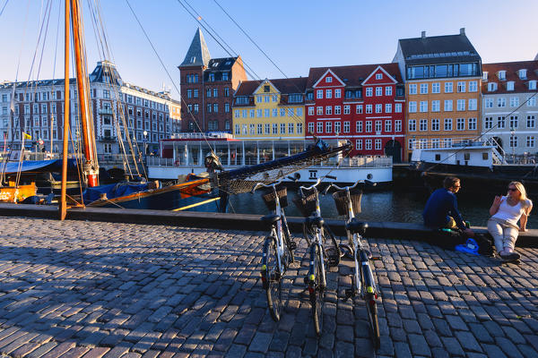 Tourist and bike in Nyhavn, Copenhagen, Hovedstaden, Denmark, Northern Europe.