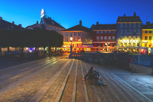 Tourist in Nyhavn, Copenhagen, Hovedstaden, Denmark, Northern Europe.