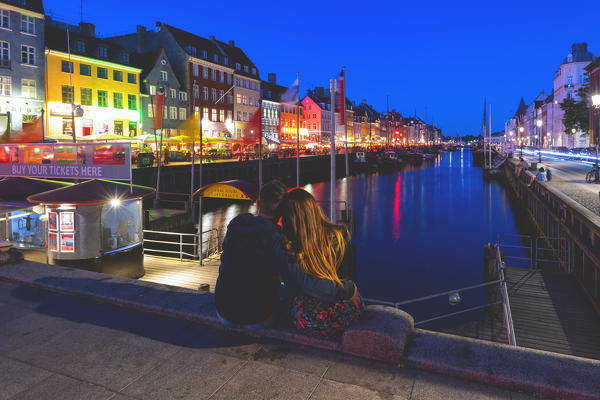 Tourist in Nyhavn,Copenhagen, Hovedstaden, Denmark, Northern Europe.