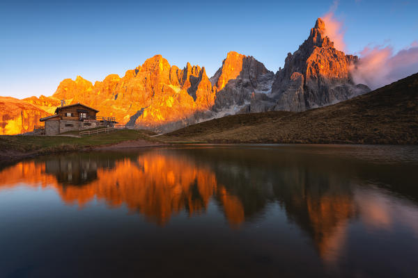 Baita Segantini and the Pale of San Martino at Tramonto, Trento province, Trentino Alto Adige, Italy.