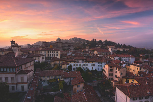 
San Vigilio and the houses of upper Bergamo view from Campanone tower at sunset in Autumn season, Bergamo, Bergamo province, Lombardy district, Italy.