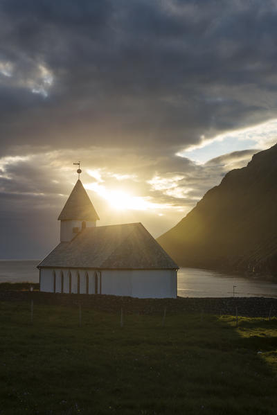 Vidareidi village, Vidoy island, Faroe Islands, Denmark. Village's church at sunset.