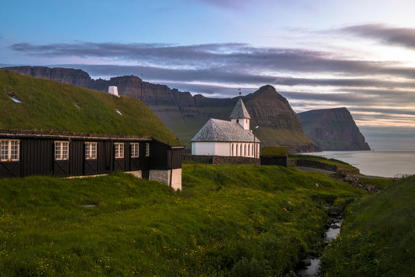 Vidareidi village, Vidoy island, Faroe Islands, Denmark. Village's church at sunset.