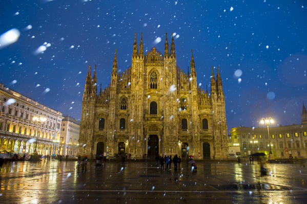 Milan's Duomo cathedral in winter with snow and artificial lights. Milan, Lombardy, Italy