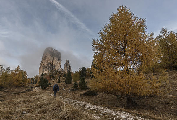 Cinque Torri, Cortina d'Ampezzo, Dolomiti, Dolomites, Veneto, Italy. Hiker at Cinque Torri